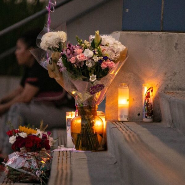 1187974 students place flowers candles at helen bernstein high school cull jja 0003