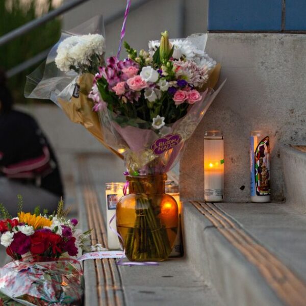 1187974 students place flowers candles at helen bernstein high school cull jja 0002
