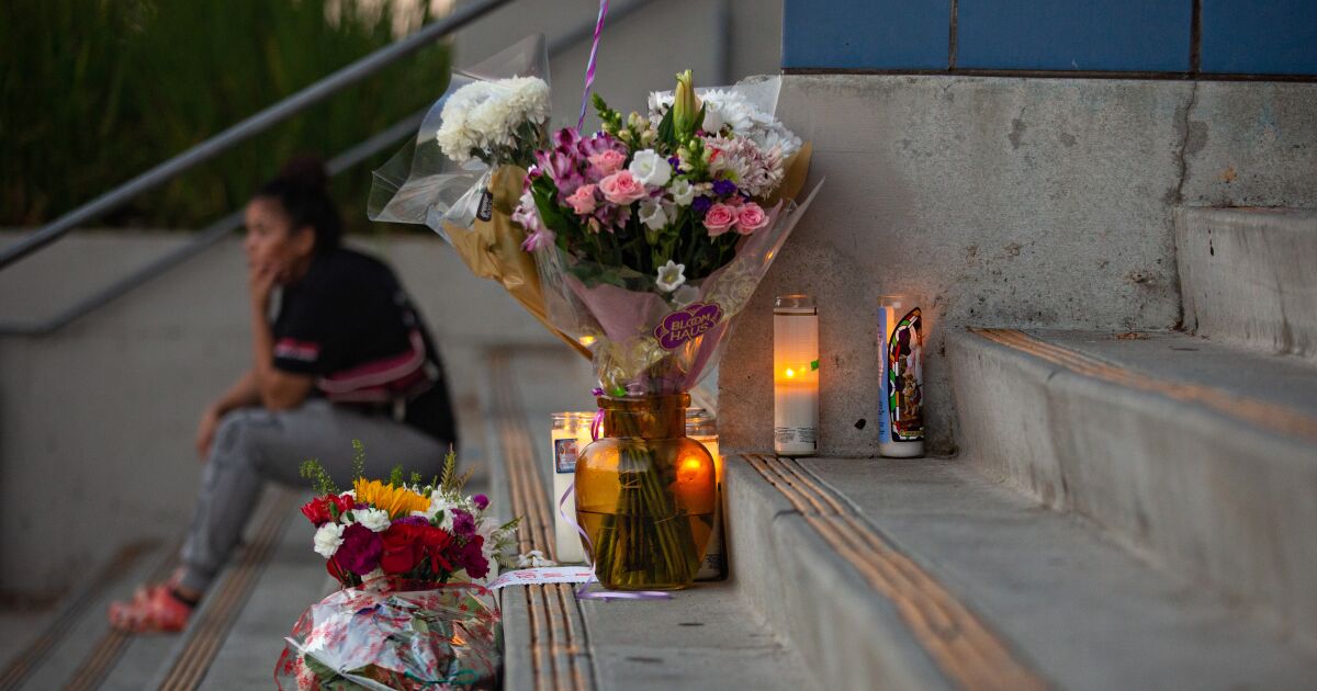 1187974 students place flowers candles at helen bernstein high school cull jja 0002