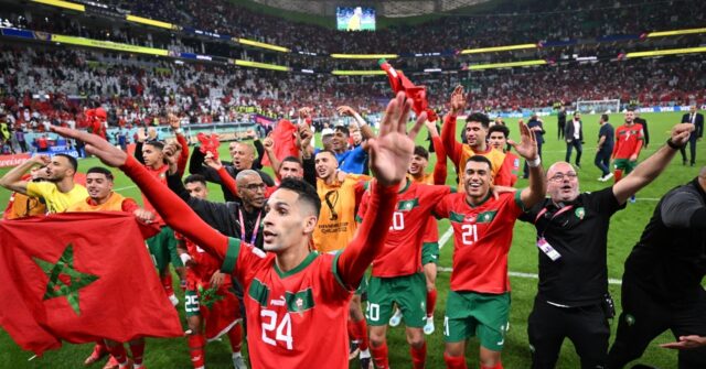 morocco players celebrate supporters beat portugal cup quarter finals afp